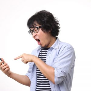 Asian-Man-Pointing-at-Phone